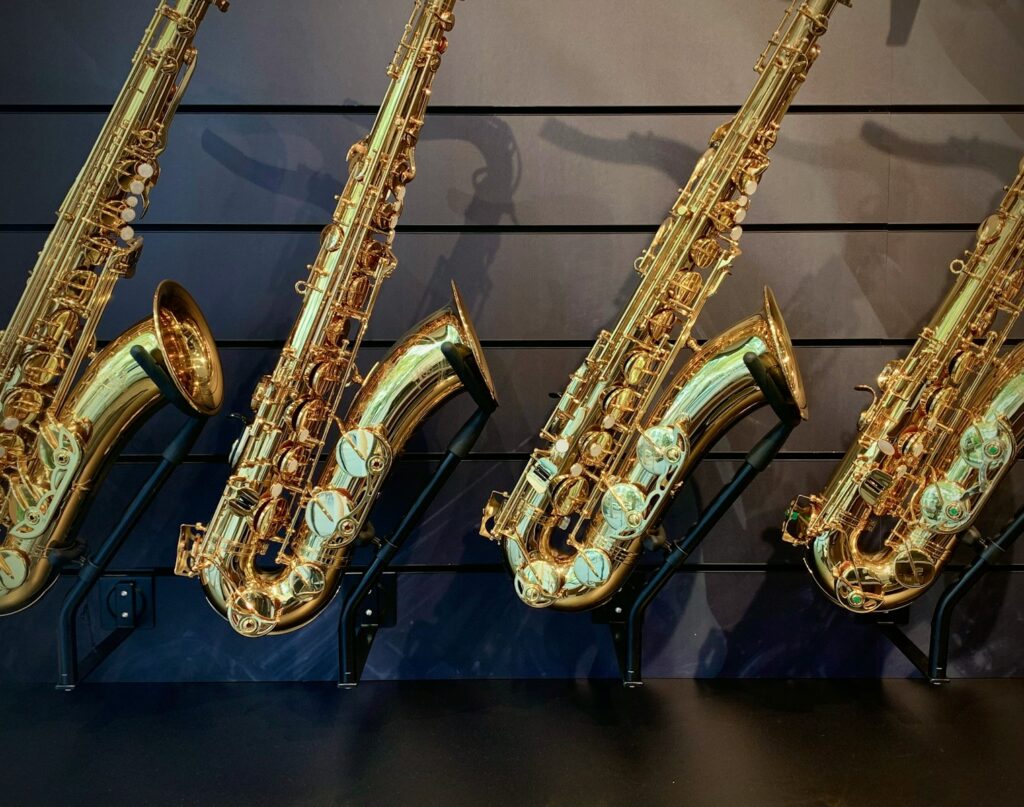 a row of saxophones lined up against a wall