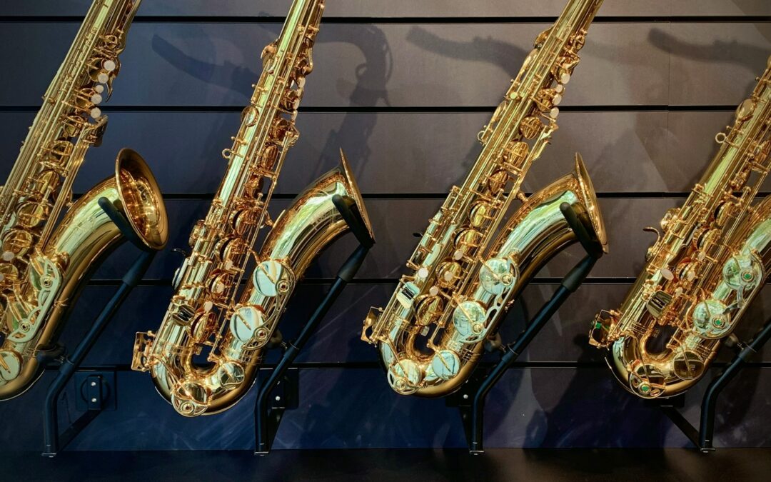 a row of saxophones lined up against a wall
