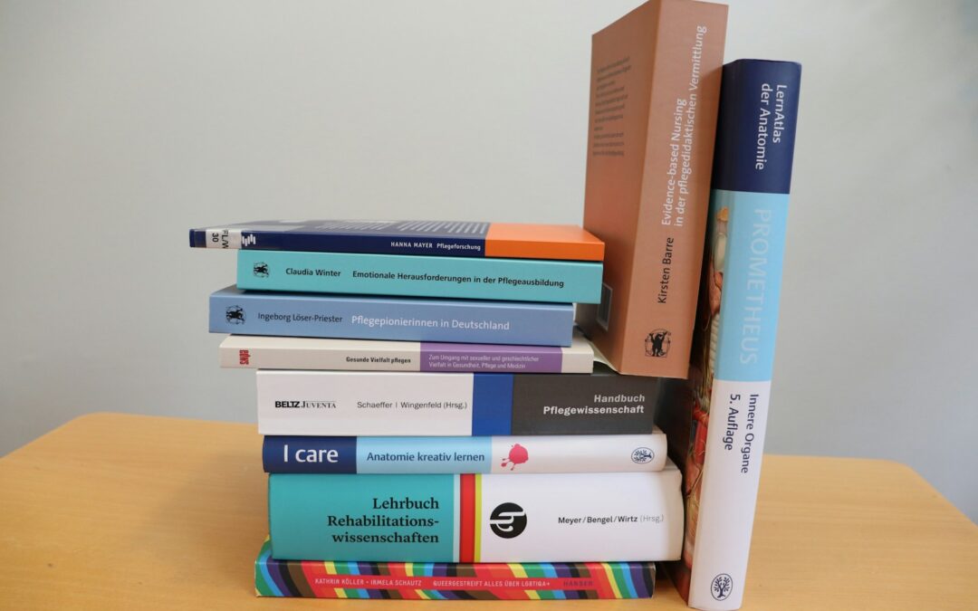 A stack of books sitting on top of a wooden table