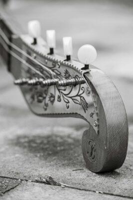 Close-up of an antique stringed instrument headstock