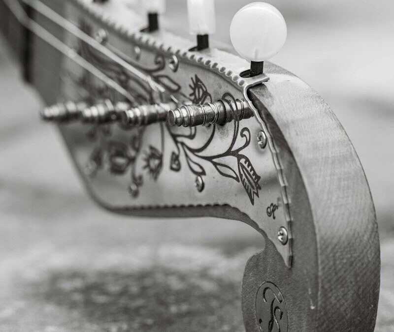 Close-up of an antique stringed instrument headstock